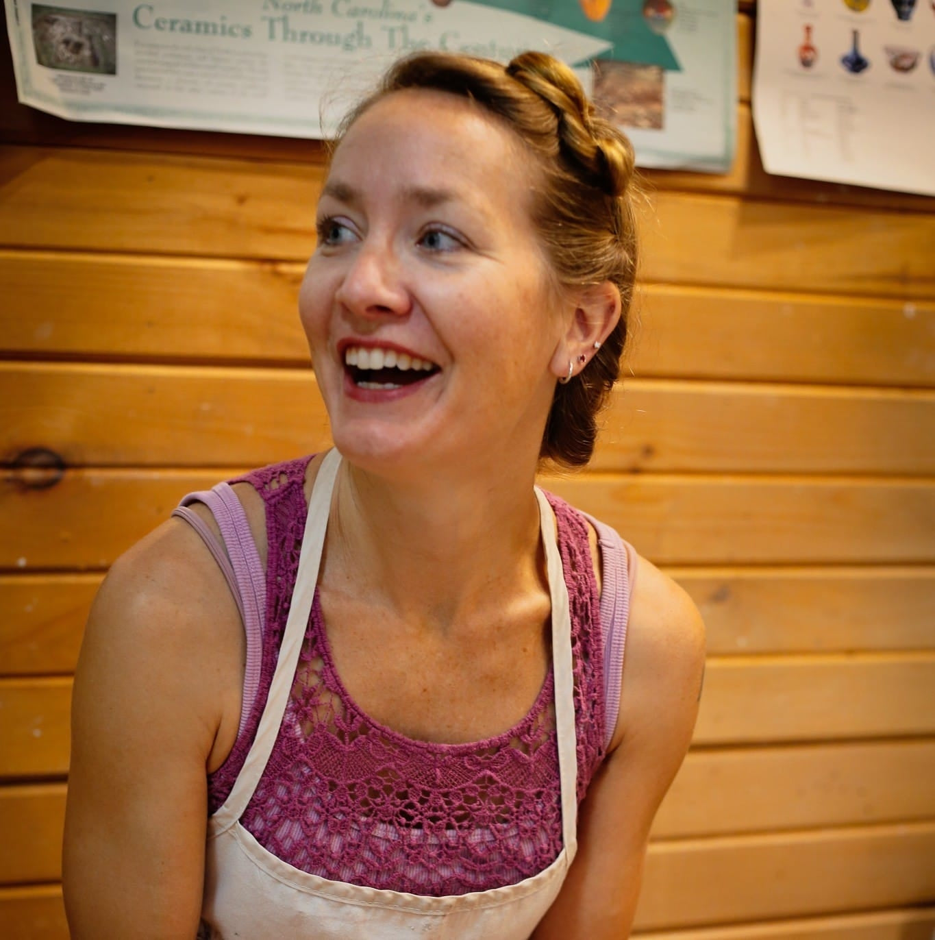 Julie Berkowitz, smiling, in her studio apron